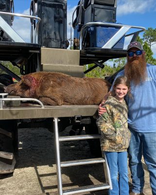 Mark and his daughter with a good boar this morning.